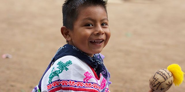 Huichol Indian Boy with Rattle. Learning shamanic traditions from childhood.