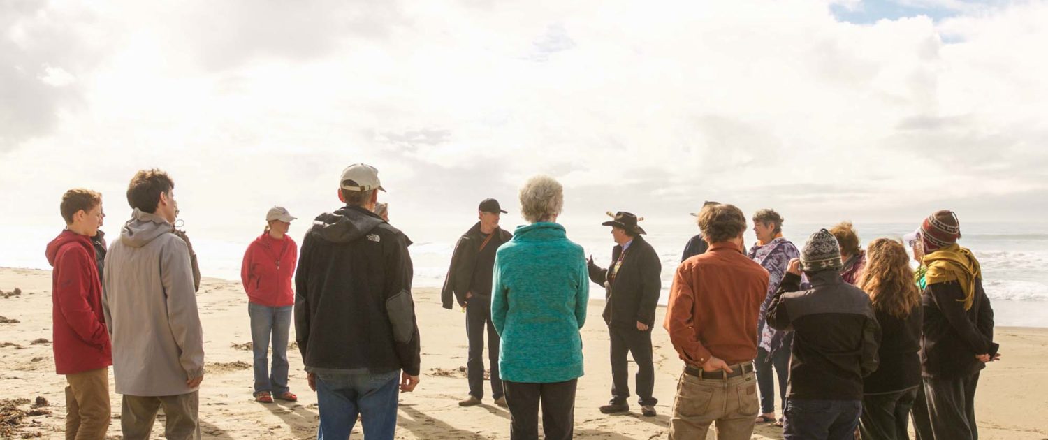 A community circle on the beach of Santa Cruz, CA