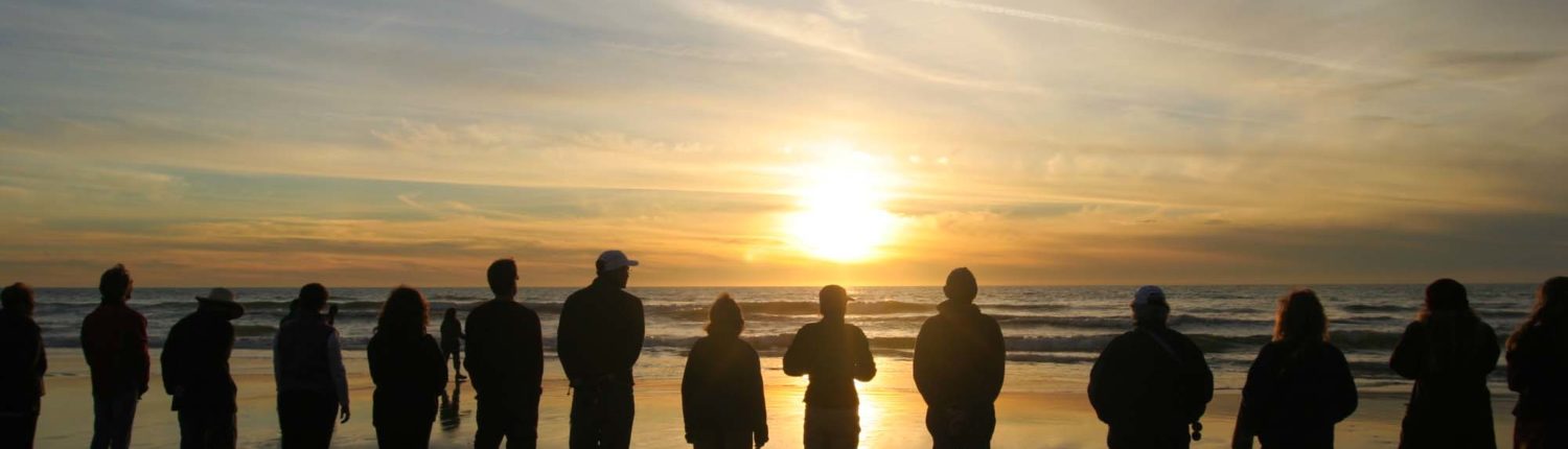 A sunset ceremony alongside the pacific ocean