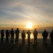 A sunset ceremony alongside the pacific ocean