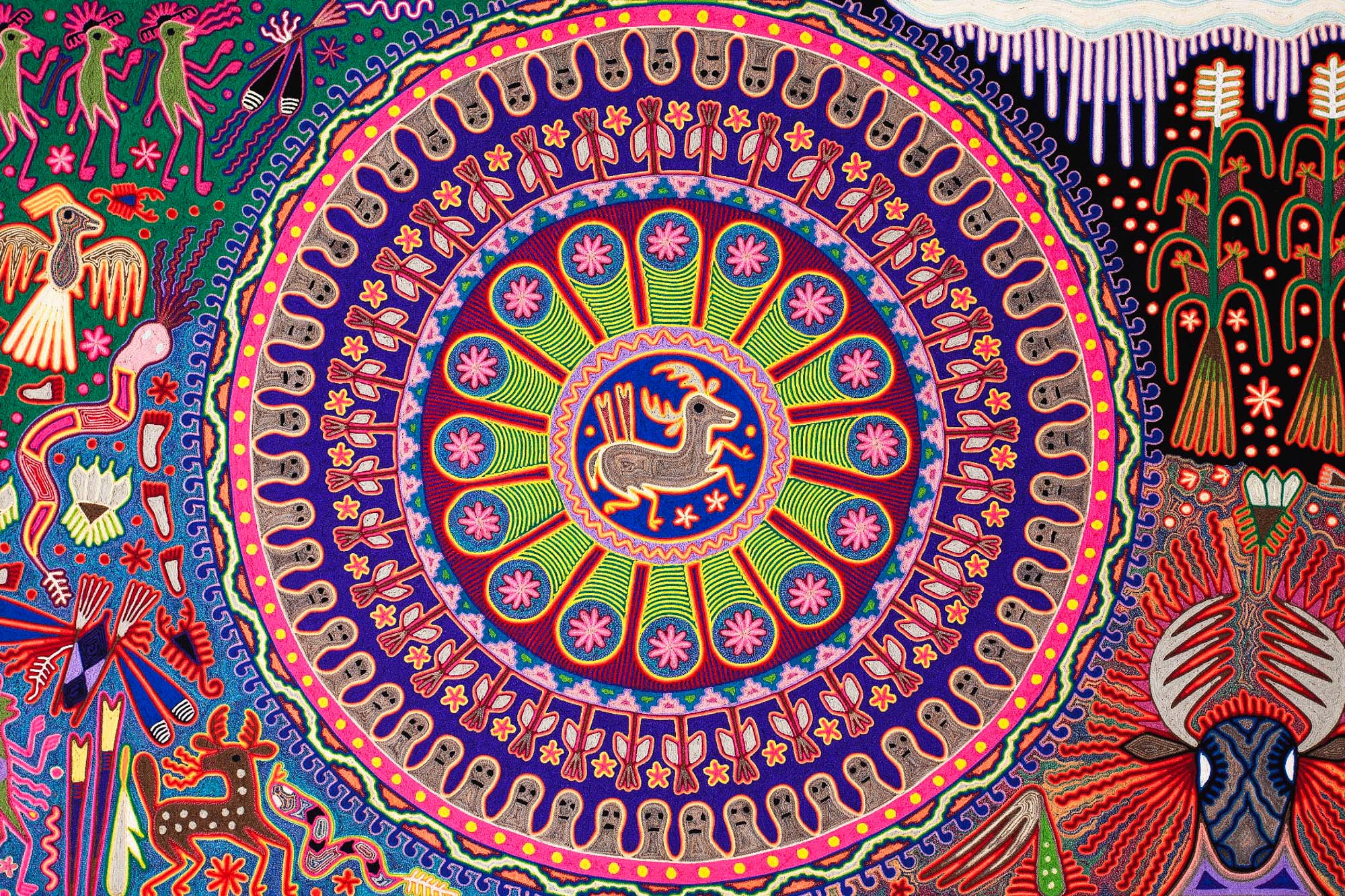 A traditional Huichol yarn painting