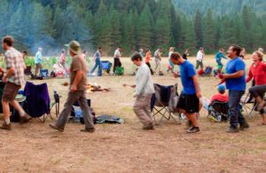 Retreat participants perform a Deer Dance in nature